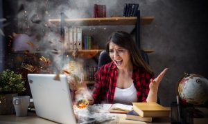 A woman deals with a laptop overheating and having a cartoonish explosion due to poor ventilation, dirty fans, and too many undeleted files.