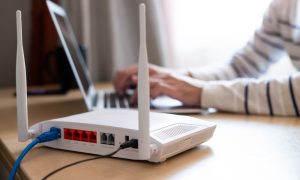 A network administrator chooses between WPA and WPA2 when configuring a router.