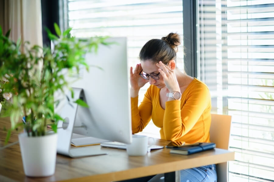 Woman frustrated because her PC's download speed is so slow