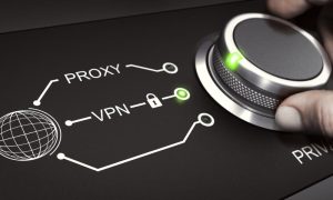 A knob turned by hand selects VPN vs. proxy.
